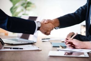 lawyers shaking hands at a meeting