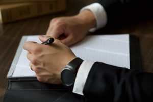 Lawyer signing documents