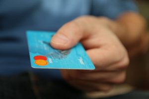 man using a debit card