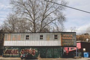 shipping containers covered in graffiti