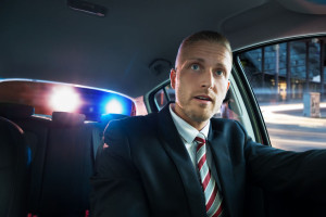 41318904 - portrait of a young scared man pulled over by police